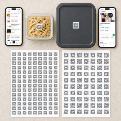 QR Pantry Starter Pack: a sheet of 126 numbered food labels and a sheet of 70 numbered storage labels, with labels on a meal container and a storage box beside two phones showing the QR Pantry app